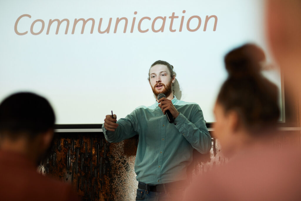 A man presenting a professional growth plan on in-person communication